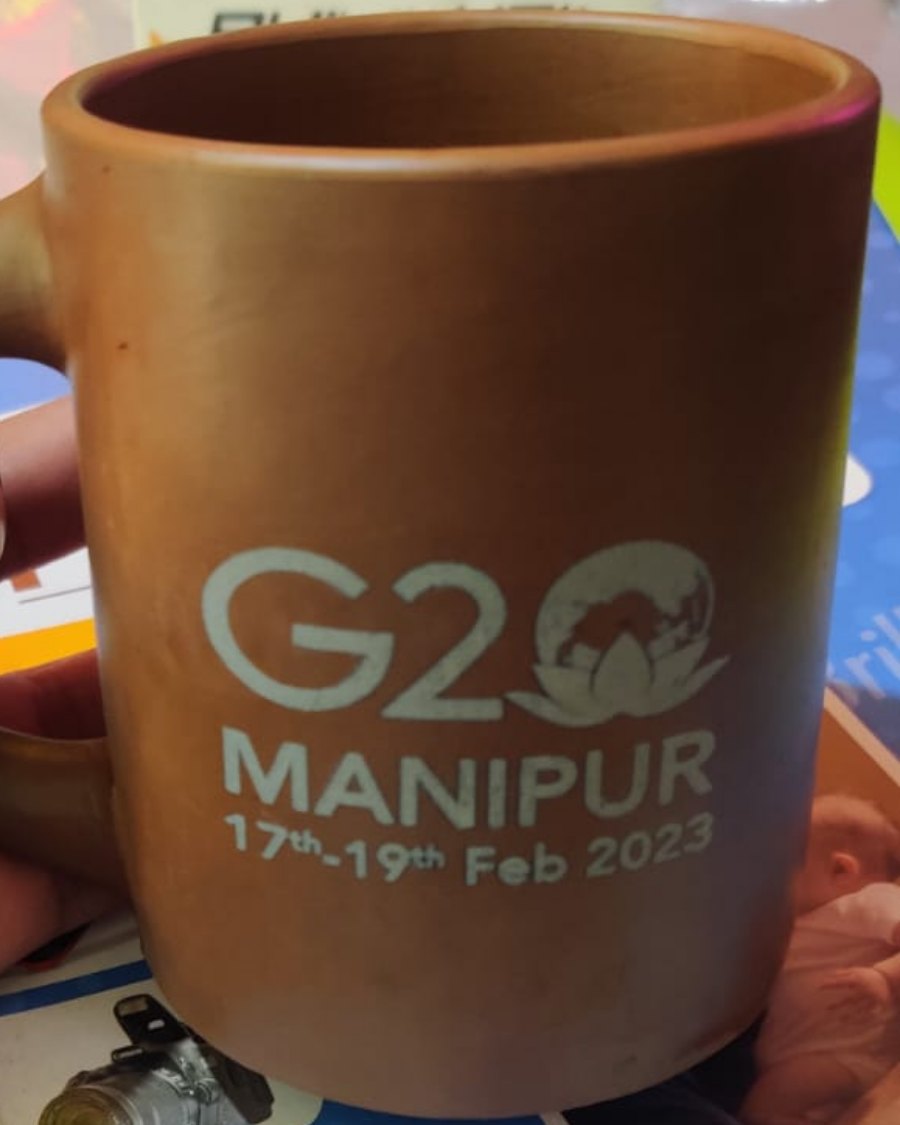 A Parables mug marked with the G20 Manipur 2023 emblem
