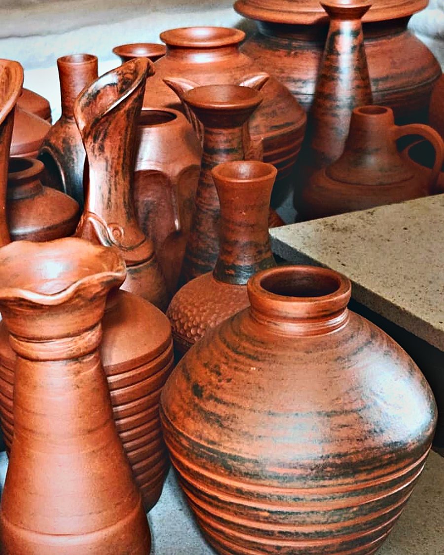 Kiln shelves stacked with fired vessels